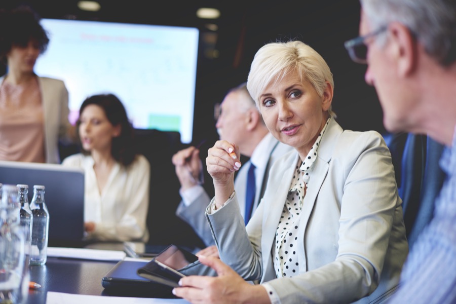 Professionals reviewing regulatory guidance together